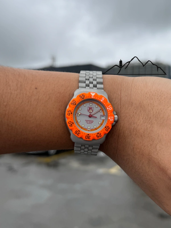 TAG Heuer Formula 1 bisel naranja, brazalete de acero